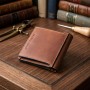 Компактне портмоне унісекс з накладної монетницьою GRANDE PELLE 11238 Коричнева